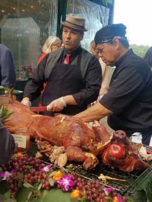 a man cutting a pig 